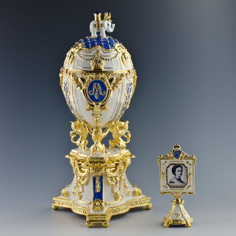   lions, the white enameled egg is marked by diamond set imperial crown