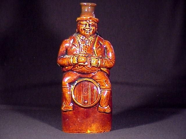 TWO FISTED DRINKER ON A BARREL  FIGURAL BOTTLE   1860S  